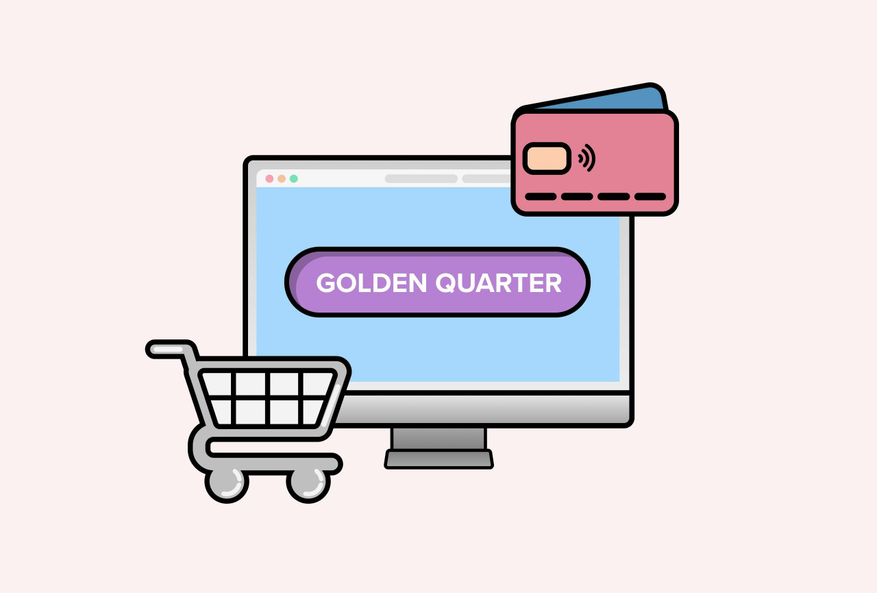 "Golden Quarter" written on a laptop screen, with shopping cart and credit card beside the screen. 